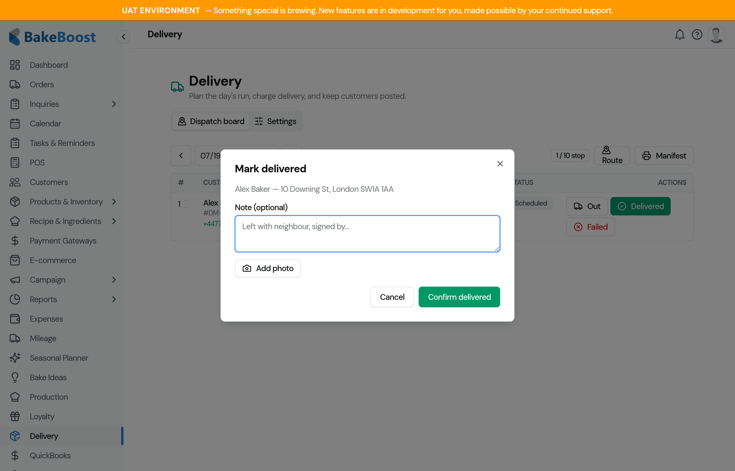 The Mark delivered dialog showing the customer and address, an optional note field, and an Add photo button, with Cancel and Confirm delivered buttons