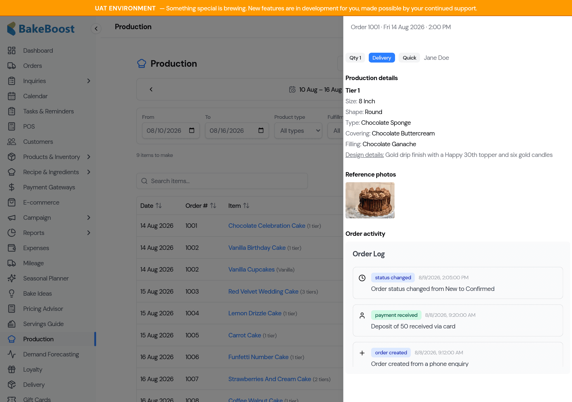 The item detail panel showing the cake's tier-by-tier production details, a reference photo, and the order activity log